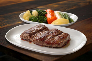 Grilled Mignon with vegetables on the table