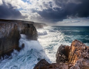 Waves crashing against rugged cliffs under a dramatic sky