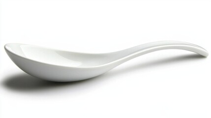 A single white spoon with a glossy surface, isolated on a white background.