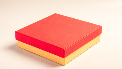An open gift box with a red textured lid and a brown kraft paper base, placed on a clean white background, symbolizing love, surprises, and special occasions like Valentine's Day