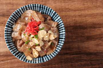 Butadon (Pork Bowl) in a Bowl with Rice.