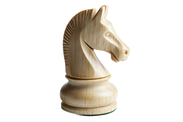 Wooden chess knight piece displayed on a table