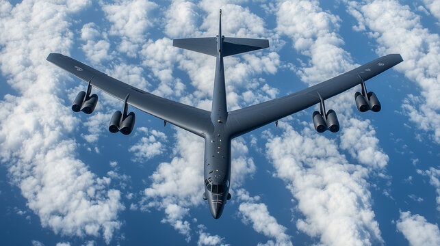 Soaring Fortress: A B-52 Stratofortress aircraft gracefully navigates the boundless expanse of the sky, its colossal form contrasting starkly against a canvas of clouds, symbolizing strength.