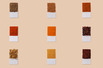 Colorful spices with white tags. Light background. Top view