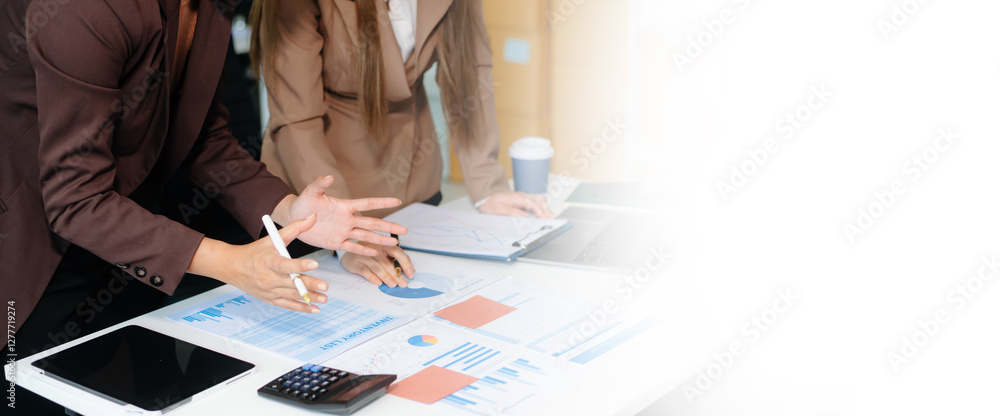 Poster business hand using laptop and tablet with social network diagram and two colleagues discussing data