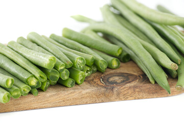 Fresh Green Beans Arranged on a Rustic Wooden Cutting Board