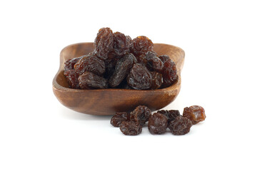 Small wooden bowl brimming with plump, dark raisins, ready to be enjoyed as snack or used in baking.