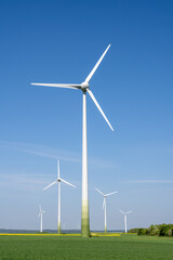 Modern wind energy plants with agricultural fields seen in Germany