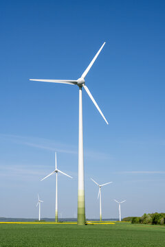 Modern wind energy plants with agricultural fields seen in Germany