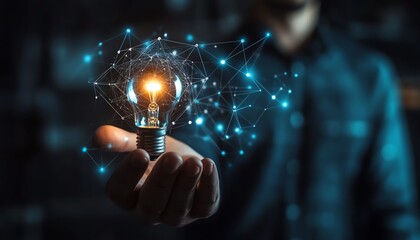 Business network and technology transformation, man holding a lightbulb and smartphone, laptops, and a powerful computer network infrastructure