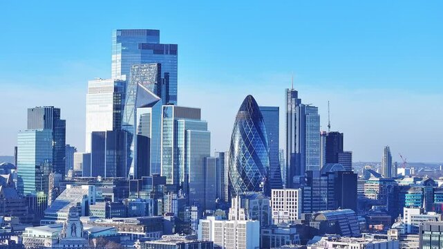 Aerial drone shot of the business district London skyline including The Gherkin and Heron Building, by the River Thames, London, United Kingdom