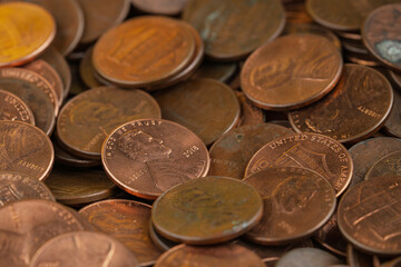 Close-up of a pile of US pennies, showcasing financial savings, currency, and investment concepts.