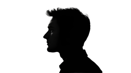 Silhouette of a young man in profile against light