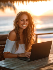 A woman with laptop at a tropical beach.