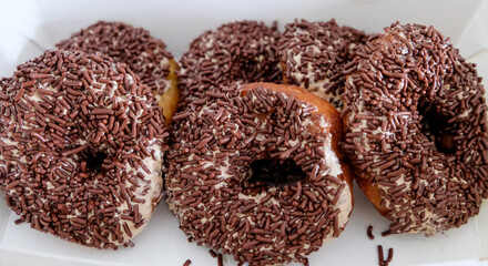 Close-up of donut with chocolate sprinkle.