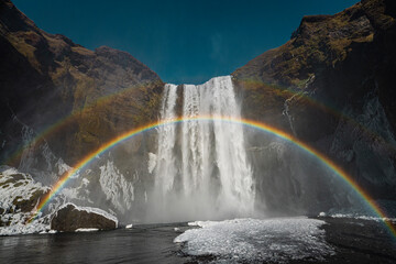 A rainbow on skogafoss, a waterfall in Iceland.