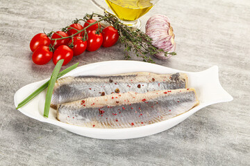 Marinated herring fillet with green onion