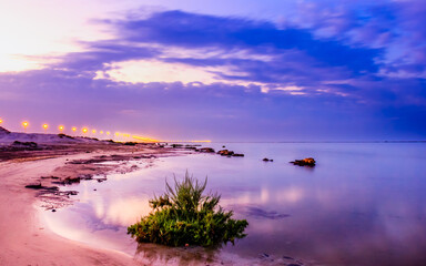 Scenic view along beach in Yas island at sunset