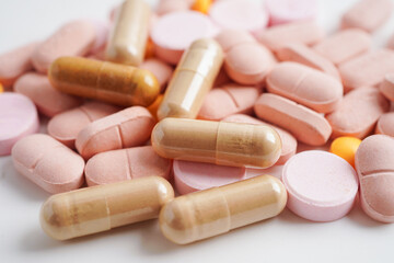 Tablets and capsules drug medicine on white background.