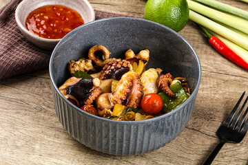 Roasted octopus with vegetables and oil