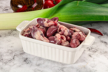 Raw chicken hearts in the bowl