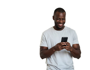 Smiling cheerful young african american man wearing casual basic tshirt standing using mobile cell phone typing text message isolated on white color wall background studio portrait.