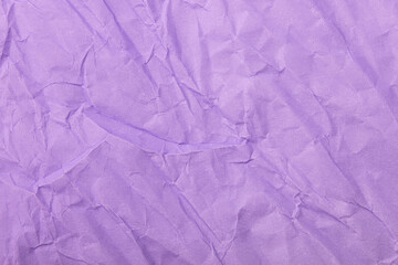 Abstract wrinkled purple crumpled paper texture background
