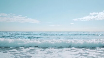 Serene Ocean Wave Under a Calm Blue Sky