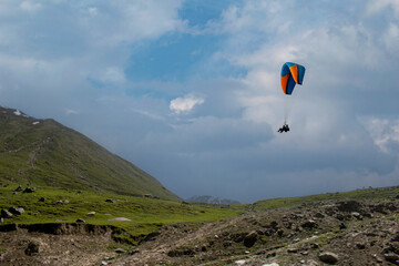 Paragliding over the clouds sunset view at Bir Billing Himachal Pradesh India. Clouds in the sky