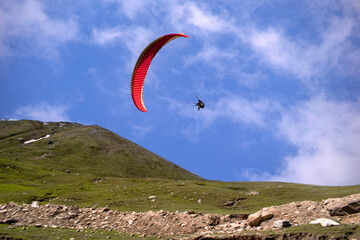 Paragliding over the clouds sunset view at Bir Billing Himachal Pradesh India. Clouds in the sky