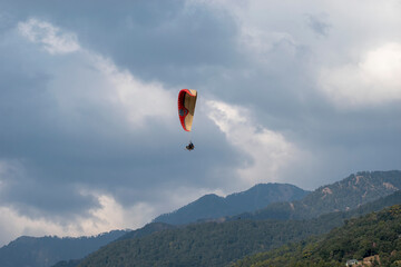 Paragliding over the clouds sunset view at Bir Billing Himachal Pradesh India. Clouds in the sky