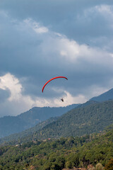 Paragliding over the clouds sunset view at Bir Billing Himachal Pradesh India. Clouds in the sky
