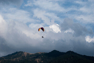 Paragliding over the clouds sunset view at Bir Billing Himachal Pradesh India. Clouds in the sky