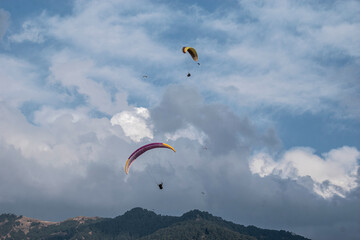 Paragliding over the clouds sunset view at Bir Billing Himachal Pradesh India. Clouds in the sky