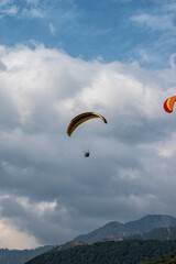 Paragliding over the clouds sunset view at Bir Billing Himachal Pradesh India. Clouds in the sky