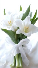 Obraz premium Elegant White Tulips Bouquet Tied with Sheer Ribbon on Soft Fabric Background Capturing Serene Beauty and Freshness for Special Occasions