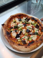 A delicious pizza with a golden crust, melted cheese, and savory toppings. Perfect for food-related designs, menus, or Italian-themed projects, capturing the essence of a classic comfort dish.