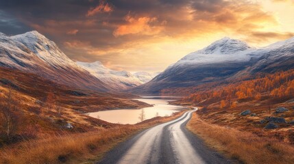 Fototapeta premium Winding road leading through a mountainous landscape at sunset