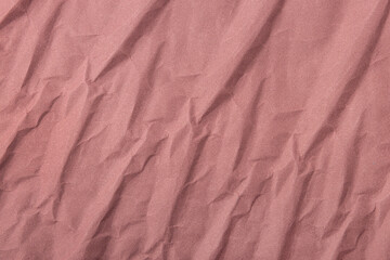 Abstract wrinkled muted mauve crumpled paper texture background	