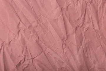 Abstract wrinkled muted mauve crumpled paper texture background	