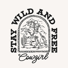 Vector T-shirt graphic with a cowgirl on a rearing horse in a desert landscape with cacti, framed by a rope border. The bold text "Stay Wild and Free Cowgirl" 
