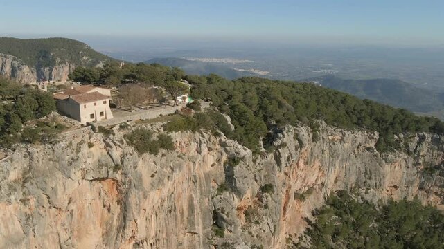 Stunning aerial views showcase the rugged cliffs and lush landscapes of Mallorca, highlighting the beauty of Cap Formentor and the historical Castell de Alaro.