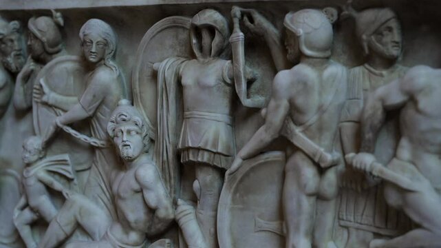 Ancient Roman marble carved sarcophagus depicting battle scene of Roman victorious military, prisoners and the vanquished.
