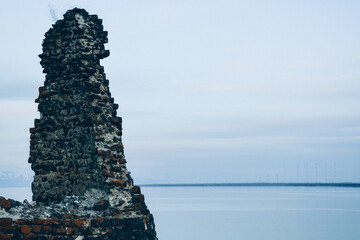 Abandoned castle. Castle ruins. Destroyed walls of an old fort. Old architecture.