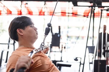 Tired overweight man exercising in gym exhaustion displayed fitness journey indoor close-up