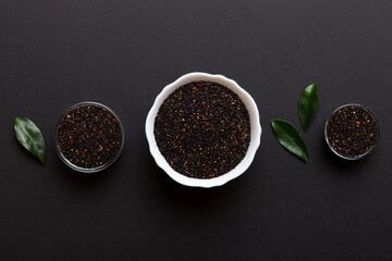 quinoa seeds in bowl on colored background. Healthy kinwa in small bowl. Healthy superfood