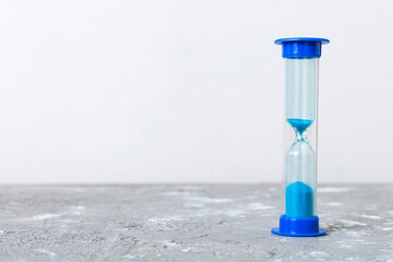 hourglass on the table, sand clock as time passing concept for business deadline, copy space