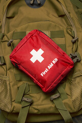 Naklejka premium First Aid Kit on army backpack