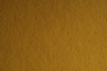 Macro close-up of dark golden textured background creating visually appealing image