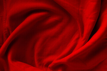 Crimson cloth artfully draped, cascading folds in a sea of red, a visual symphony of texture, color and flow. Elegant, yet powerful.